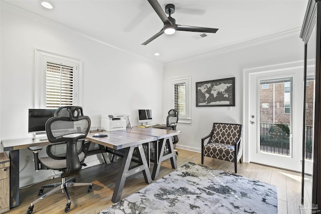 office area with crown molding, ceiling fan, and light hardwood / wood-style flooring