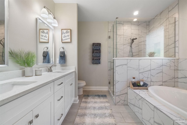 full bathroom featuring tile patterned floors, vanity, toilet, and independent shower and bath