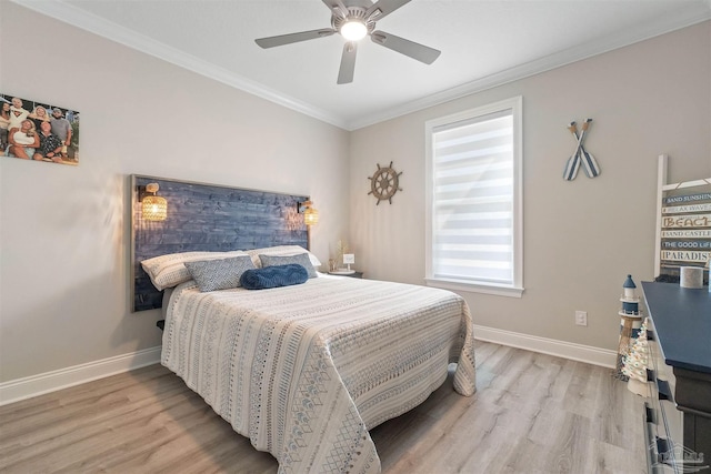 bedroom with light hardwood / wood-style flooring, ceiling fan, and crown molding