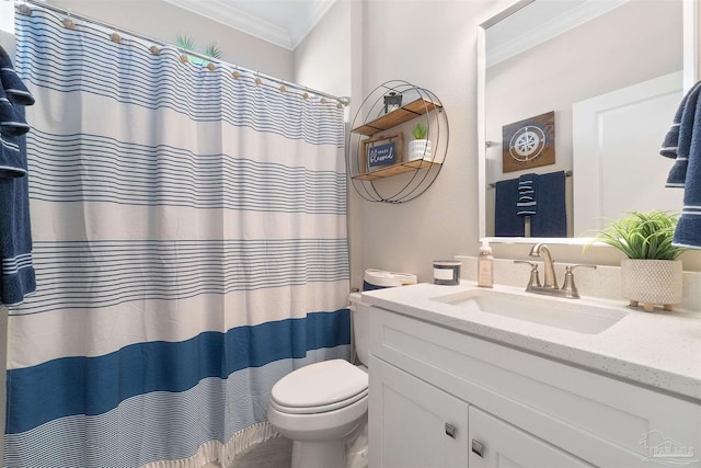 bathroom with vanity, toilet, and crown molding