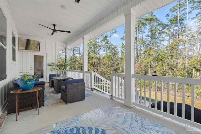 sunroom / solarium with ceiling fan and a healthy amount of sunlight