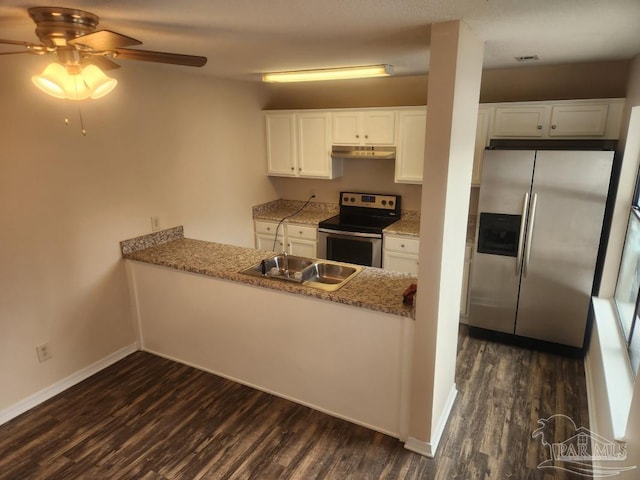 kitchen featuring dark wood-type flooring, sink, stainless steel appliances, light stone countertops, and white cabinets