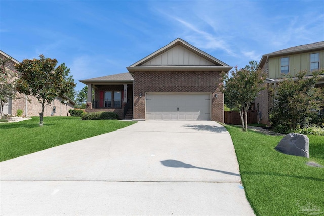 view of front of house featuring a garage and a front lawn