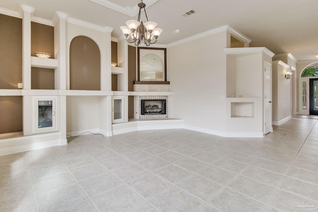 unfurnished living room with crown molding, light tile patterned floors, built in shelves, and a notable chandelier