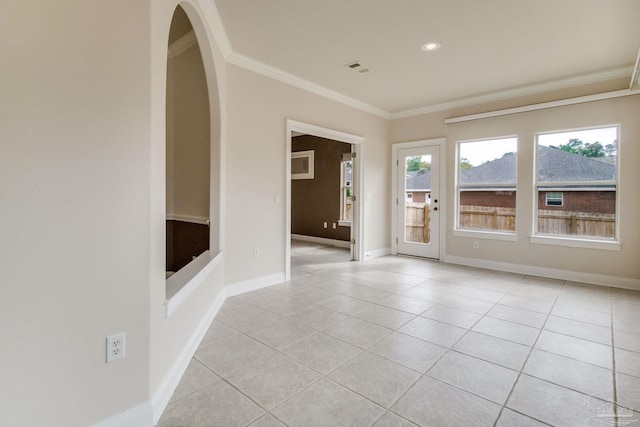 tiled empty room with crown molding