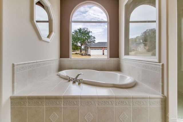 bathroom featuring tiled bath