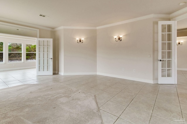 tiled empty room featuring french doors and ornamental molding