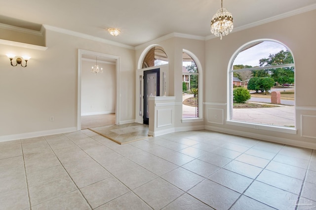 spare room featuring light tile patterned flooring, crown molding, and a notable chandelier