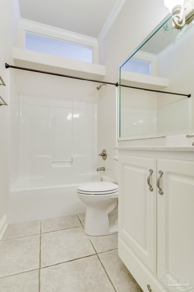 bathroom with crown molding, tile patterned floors, toilet, and bathing tub / shower combination