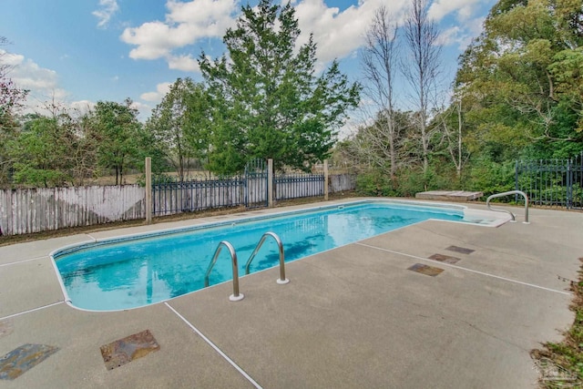 view of pool featuring a patio