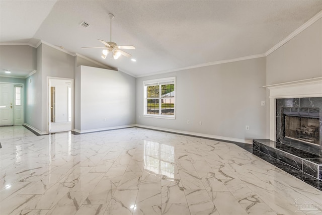 unfurnished living room featuring ceiling fan, lofted ceiling, ornamental molding, and a premium fireplace