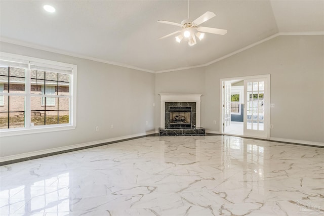 unfurnished living room with plenty of natural light, ceiling fan, lofted ceiling, and crown molding