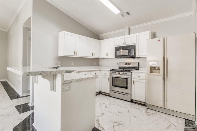 kitchen with vaulted ceiling, stainless steel range with gas cooktop, white cabinets, and white refrigerator with ice dispenser