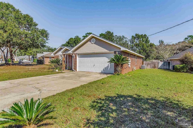 ranch-style home featuring a garage, central air condition unit, and a front yard