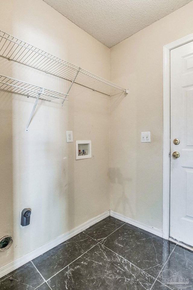 clothes washing area featuring hookup for a washing machine and electric dryer hookup