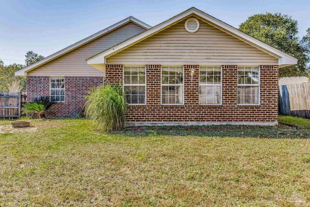 back of house featuring a yard