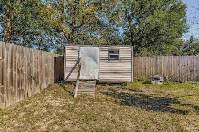 view of outdoor structure featuring a lawn