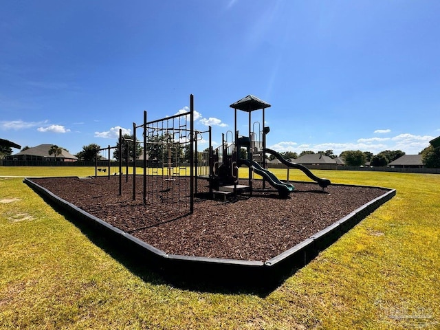 view of jungle gym featuring a lawn