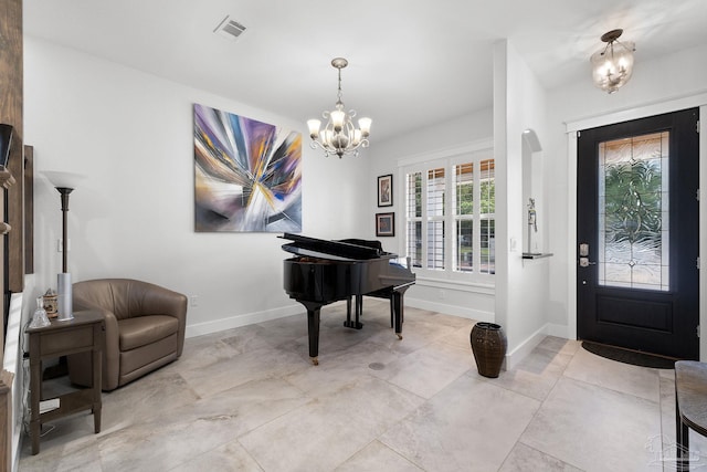 foyer entrance with an inviting chandelier