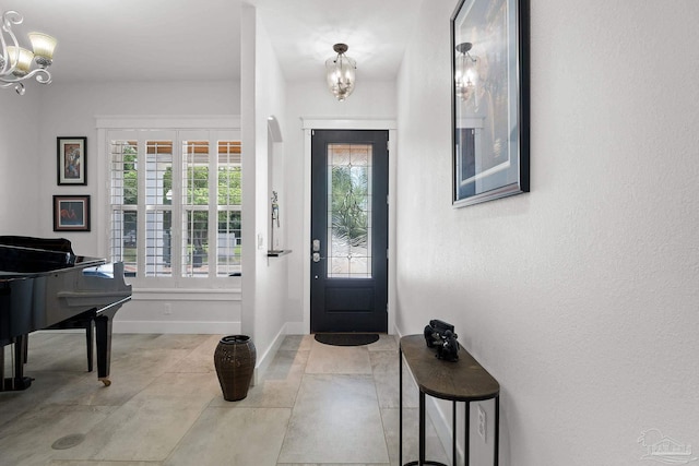 foyer entrance featuring an inviting chandelier