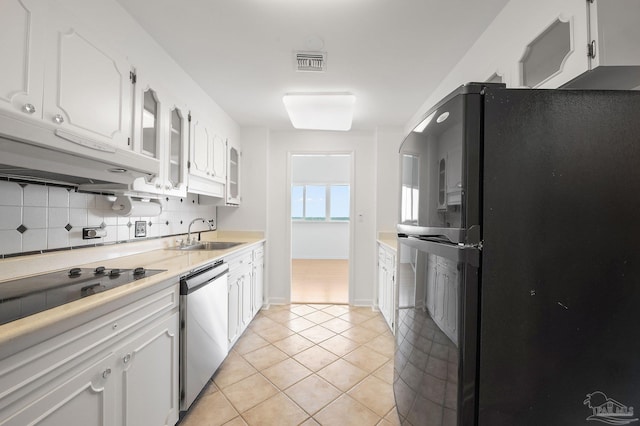 825 Bayshore Dr Unit 1206, Pensacola, FL 32507 - kitchen with black appliances, a sink, white cabinets, light countertops, and light tile patterned floors