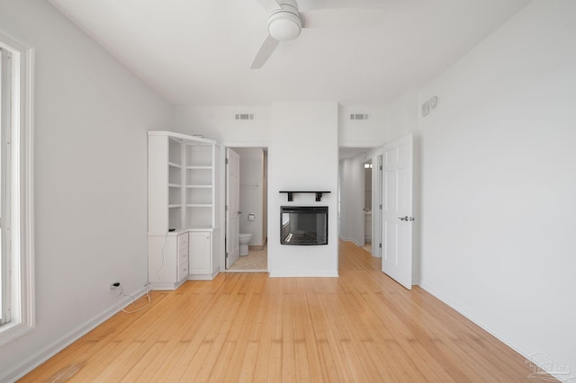 825 Bayshore Dr Unit 1206, Pensacola, FL 32507 - unfurnished living room with ceiling fan, light wood finished floors, and baseboards
