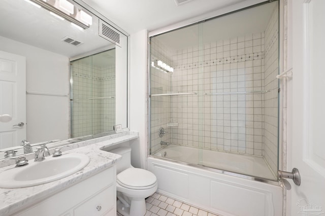 825 Bayshore Dr Unit 1206, Pensacola, FL 32507 - full bathroom with vanity, bath / shower combo with glass door, toilet, and tile patterned flooring