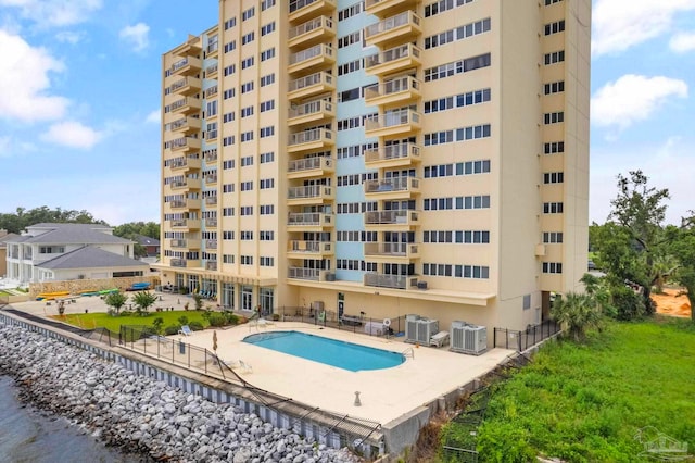825 Bayshore Dr Unit 1206, Pensacola, FL 32507 - view of apartment building / complex featuring a community pool and cooling unit