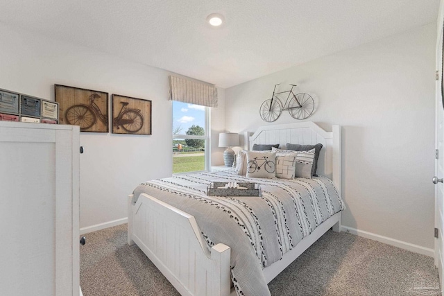 bedroom with dark carpet