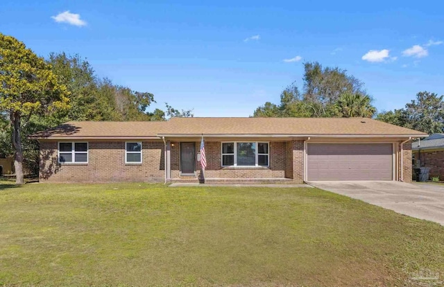 ranch-style home with a garage, brick siding, concrete driveway, and a front yard