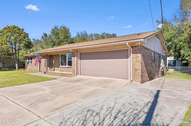 ranch-style home featuring a garage, driveway, fence, a front lawn, and brick siding