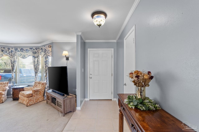 entryway featuring light carpet, light tile patterned floors, baseboards, and ornamental molding