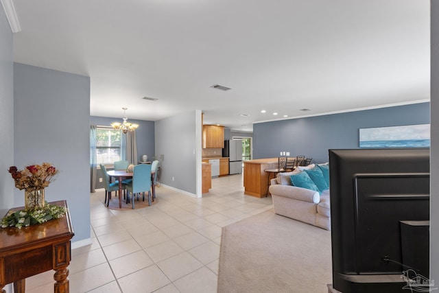 living room featuring baseboards, visible vents, a notable chandelier, and light tile patterned flooring