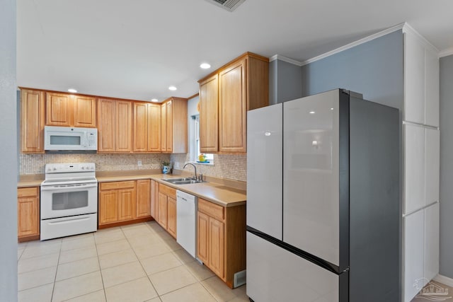 kitchen with crown molding, white appliances, a sink, and light tile patterned floors