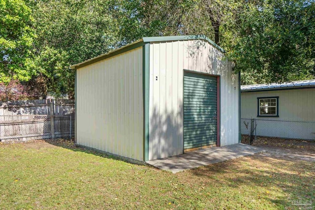 view of outbuilding with an outbuilding and fence