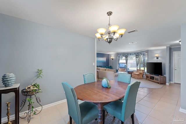 dining area with baseboards, visible vents, ornamental molding, an inviting chandelier, and light tile patterned flooring