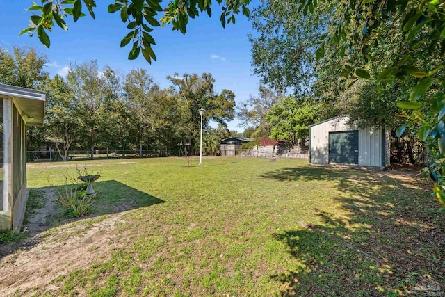 view of yard featuring an outbuilding, a fenced backyard, and a shed