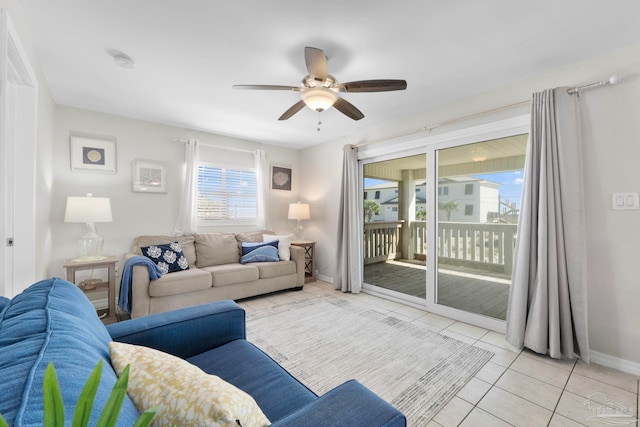 living room featuring ceiling fan and light tile patterned flooring