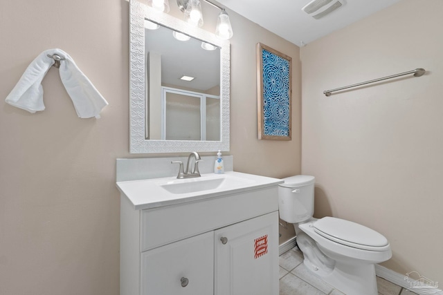 bathroom featuring walk in shower, tile patterned flooring, vanity, and toilet