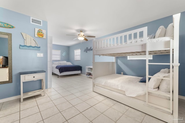 bedroom featuring tile patterned flooring and ceiling fan