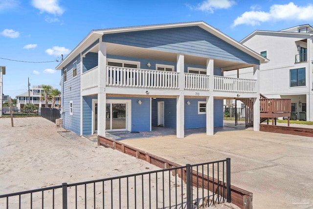 rear view of house featuring a balcony