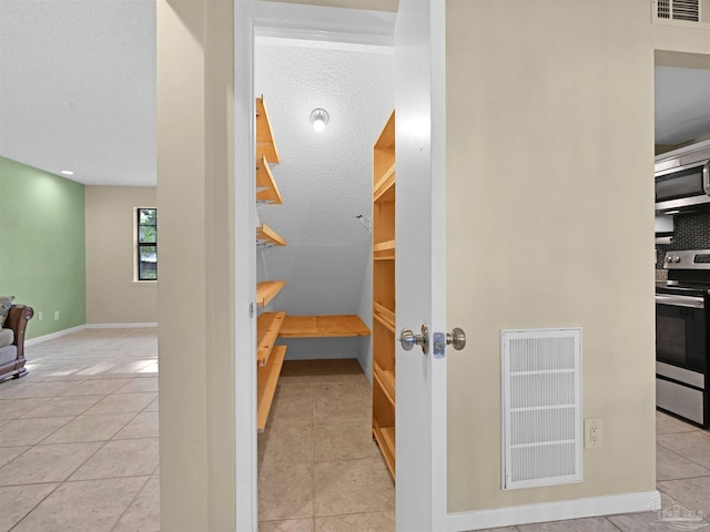 2701 E De Soto St, Pensacola, FL 32503 - hallway with tile patterned flooring and baseboards