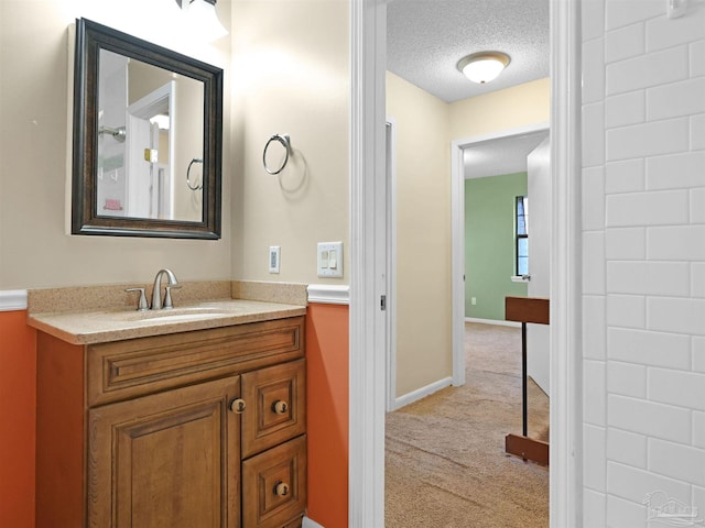 2701 E De Soto St, Pensacola, FL 32503 - bathroom with vanity, a textured ceiling, and baseboards