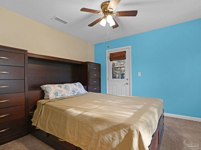 2701 E De Soto St, Pensacola, FL 32503 - bedroom with carpet floors, baseboards, and a ceiling fan