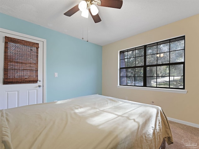 2701 E De Soto St, Pensacola, FL 32503 - unfurnished bedroom featuring carpet, baseboards, and a ceiling fan