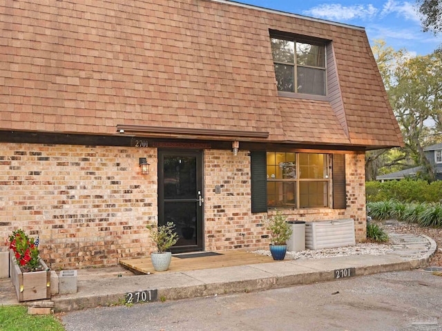 2701 E De Soto St, Pensacola, FL 32503 - view of front facade with brick siding and roof with shingles