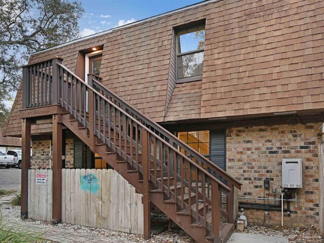 2701 E De Soto St, Pensacola, FL 32503 - exterior space with a shingled roof and brick siding