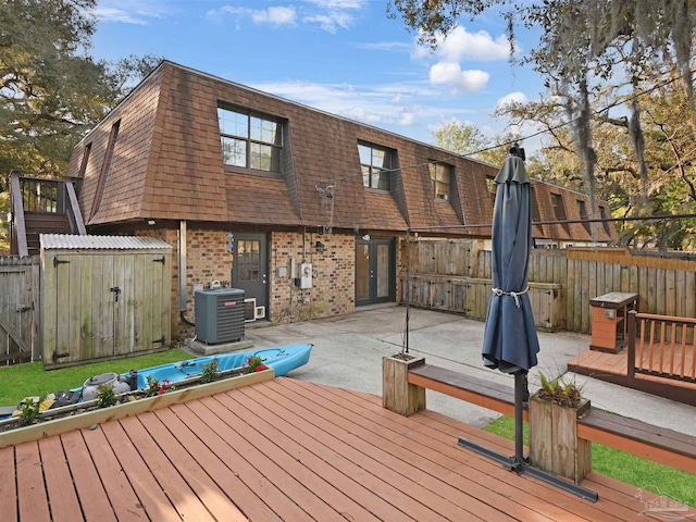 2701 E De Soto St, Pensacola, FL 32503 - wooden deck with central AC unit and a patio area