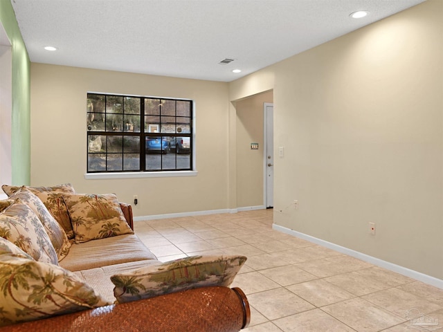 2701 E De Soto St, Pensacola, FL 32503 - living area with light tile patterned flooring, recessed lighting, baseboards, and a textured ceiling
