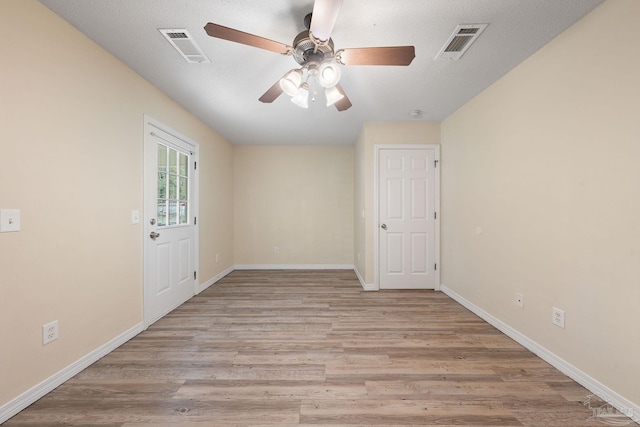 unfurnished room featuring ceiling fan and light hardwood / wood-style floors